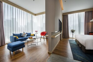 Suite, 1 cama King size | Edredón, camas con pillow-top y minibar 