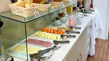 A buffet with various food items and condiments.