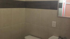 A small bathroom with a toilet and a sink.