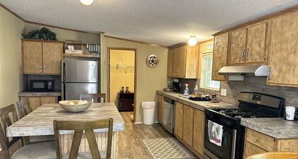 4 bd rm, 2bth modular, feat. full ktch, private deck & grill at Kick Back Ranch.