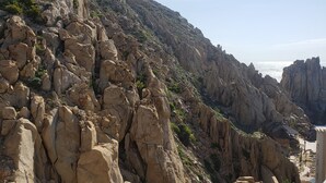 A rocky landscape with a clear sky. - Private Oceanfront Luxury (Cabo San Lucas)