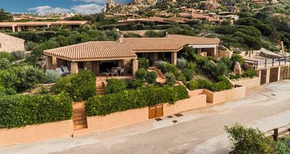 Family villa with garden, large veranda and sea-view pool at sunset