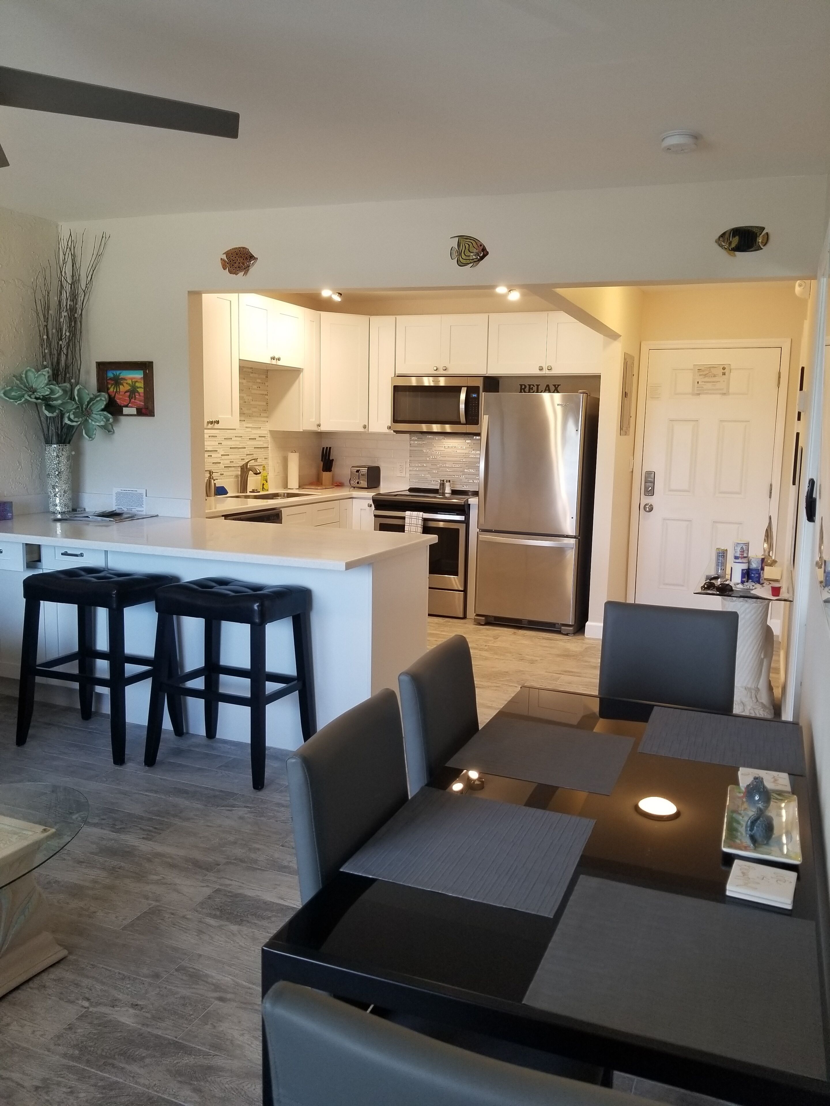 Dinner seating for 4, along with 2 bar stools.