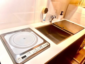 Fridge, microwave, stovetop, cookware/dishes/utensils