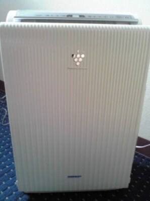 A white, ribbed, rectangular device with a logo and a few ports on top. - Standard Twin B  Smoking  Breakfast included pl / Kagoshima Kagoshima (Kagoshima)