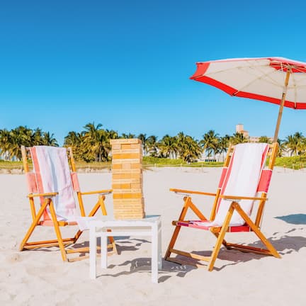 Beach nearby, white sand, sun loungers, beach towels