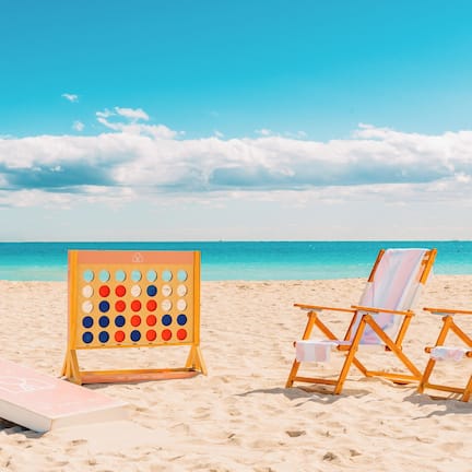 Beach nearby, white sand, sun loungers, beach towels