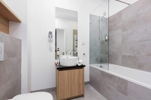 Bathtub, hair dryer, towels