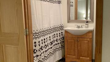 Combined shower/tub, hair dryer, towels, soap