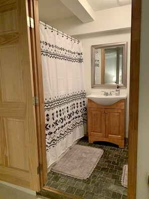 Combined shower/tub, hair dryer, towels, soap