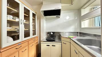Fridge, microwave, stovetop, cookware/dishes/utensils