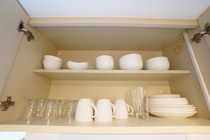 Fridge, microwave, stovetop, cookware/dishes/utensils