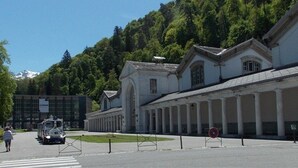 A building with a classical architectural style, featuring a long colonnade and a central entrance.