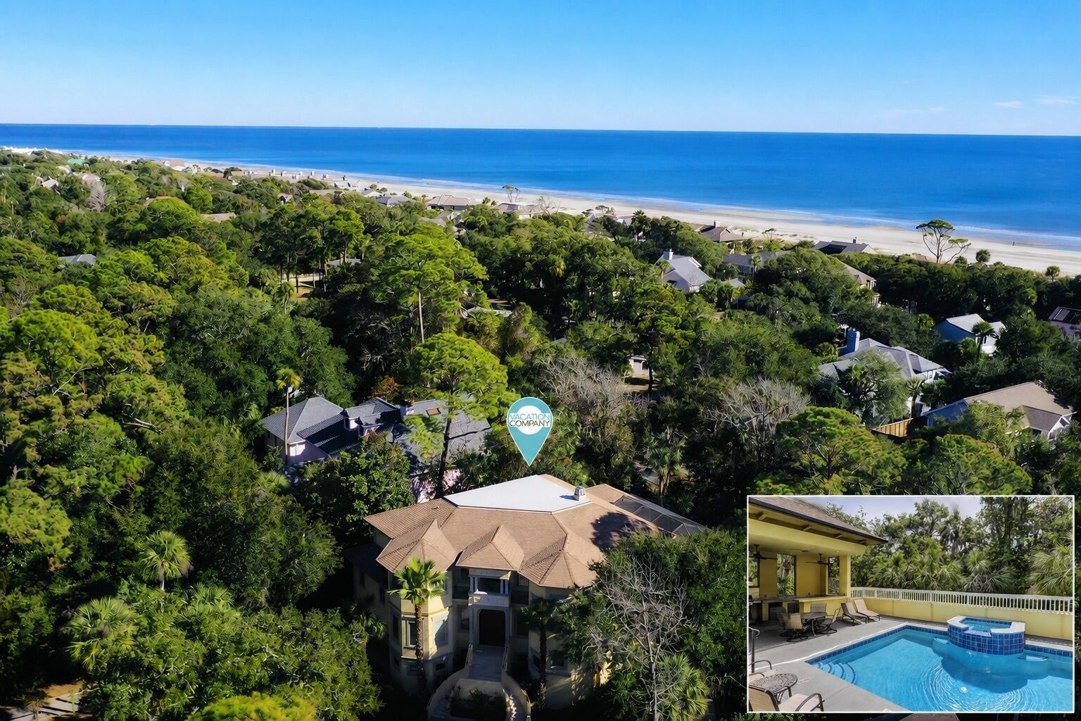 A coastal residential area with a large pool and a view of the ocean.
