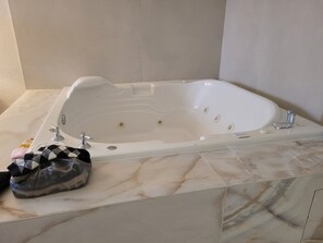 Jetted bath, hair dryer, towels, soap