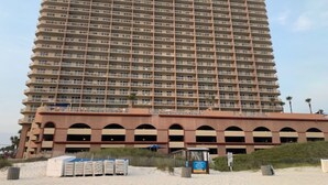 A tall, multi-story hotel with a uniform facade and numerous balconies. - Beach Front Condo-Amazing Ocean Views-Direct Access- Two Awesome Pools/Hot Tubs (Panama City)