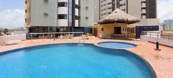 Indoor pool - Flat Number One Ferreira Hospdagens (São Luís)