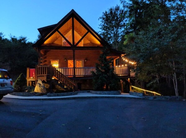 A log cabin with a balcony and a staircase leading to the entrance. - "Rushing Bear!" Fully furnished two bedroom cozy cabin you want to capture!" (Maggie Valley)