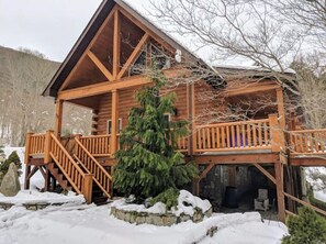 A wooden cabin with a balcony, surrounded by snow and trees. - "Rushing Bear!" Fully furnished two bedroom cozy cabin you want to capture!" (Maggie Valley)