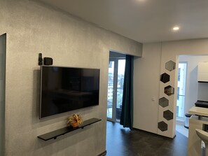 Signature Apartment | Living area | 55-inch LED TV with cable channels, TV, Netflix - Stylish Westpark2 Residence LakeView W8 (Bucharest)