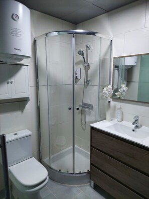 Shower, hair dryer, towels, soap