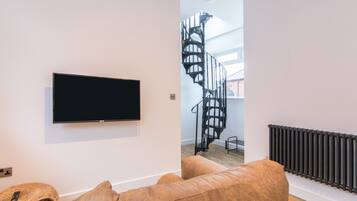 Superior Apartment | Living area | 32-inch flat-screen TV with digital channels, TV, Netflix