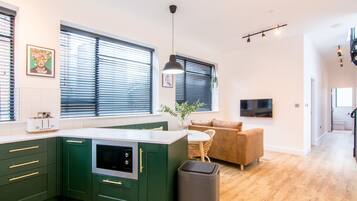 Superior Apartment | Living area | 32-inch flat-screen TV with digital channels, TV, Netflix