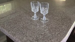 A kitchen counter with two clear glass wine glasses. - Base Camp at Hawks nest. Near many mountain activities! (Seven Devils)