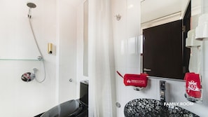 A bathroom with a shower, a toilet, and a sink. There is a red towel hanging on the wall and a mirror above the sink. - Hotel 1888 Collection (Singapore)
