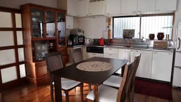 Private Vacation Home | Private kitchen | Fridge, microwave, electric kettle, cookware/dishes/utensils