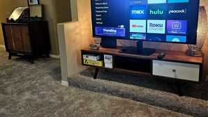 A television displaying a streaming service interface with options like Netflix, Hulu, and Prime Video.