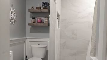 Bathtub, hair dryer, towels, soap
