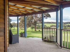 A covered outdoor area with a view of a grassy field and trees. - Burton Farmhouse Reconnect with Nature and Family (Wilyabrup)