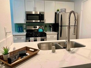 Fridge, microwave, dishwasher, coffee/tea maker