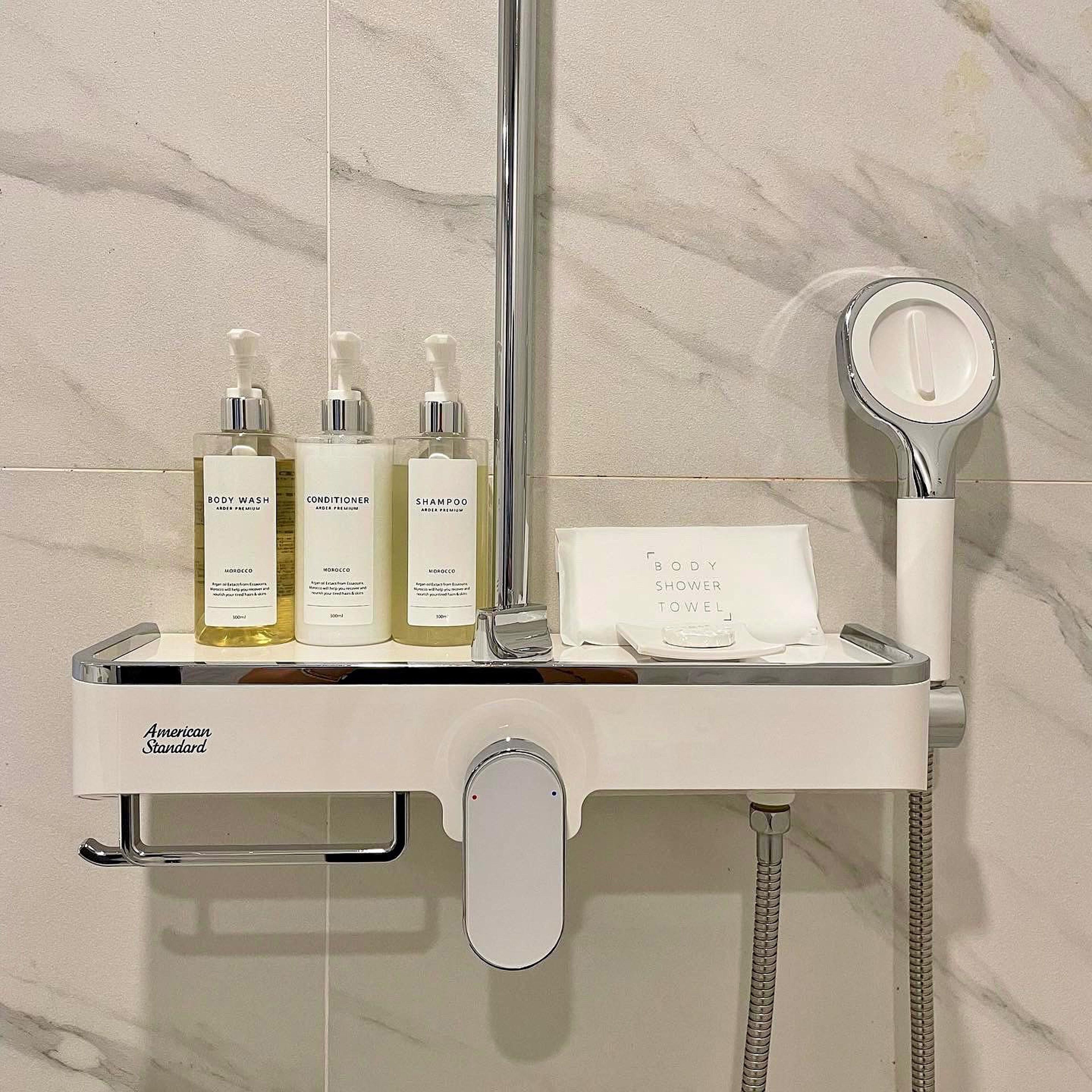 designer toiletries, hair dryer, bathrobes, slippers