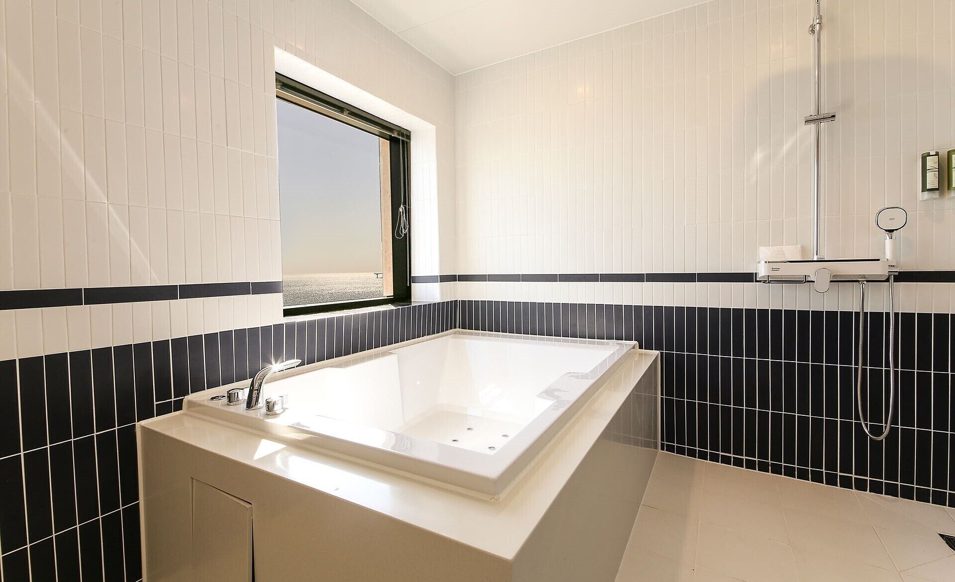 designer toiletries, hair dryer, bathrobes, slippers