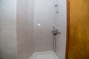 Shower, hair dryer, towels, toilet paper