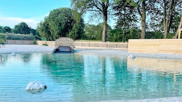 Seasonal outdoor pool, open 10:00 AM to 9:30 PM, free pool cabanas