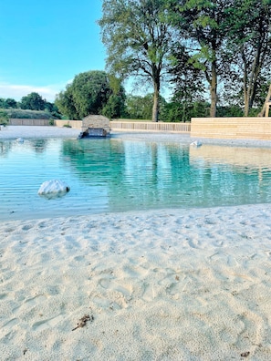 Seasonal outdoor pool, open 10:00 AM to 9:30 PM, free pool cabanas