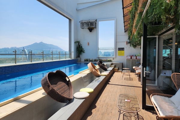 Outdoor pool, open 7:00 AM to midnight, pool umbrellas, sun loungers
