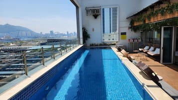 Outdoor pool, open 7:00 AM to midnight, pool umbrellas, sun loungers