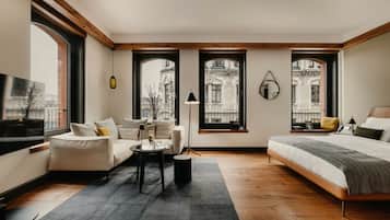 Suite Junior, 1 trĂšs grand lit, vue ville, en angle