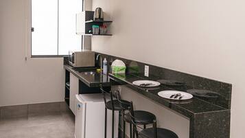 Fridge, electric kettle, cookware/dishes/utensils