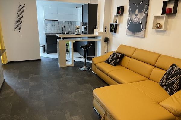 Premier Apartment | Living area | 55-inch LED TV with cable channels, TV, Netflix
