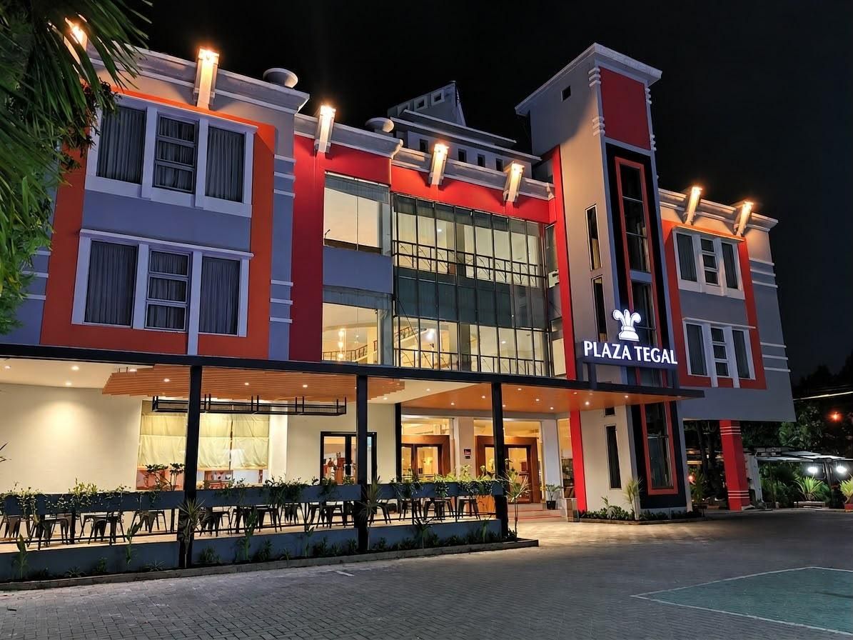 A multi-story building with a prominent sign reading 'PLAZA TELEGAL'.