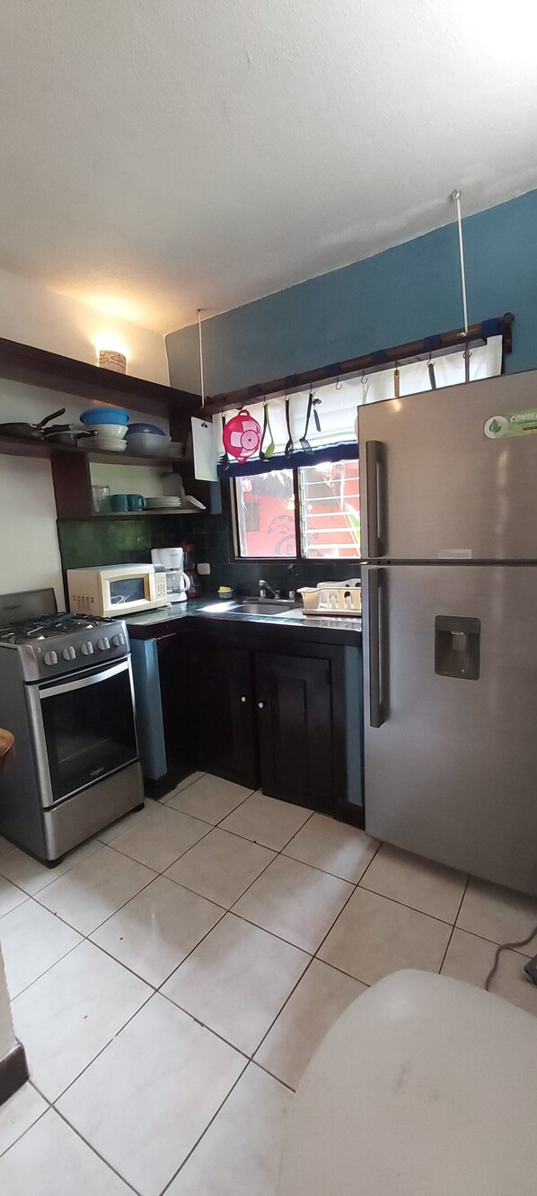 Fridge, oven, cookware/dishes/utensils