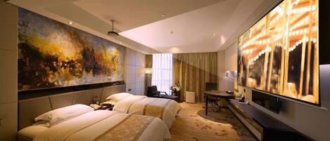 A hotel room with two beds, a large painting, a TV, and a desk with a lamp.