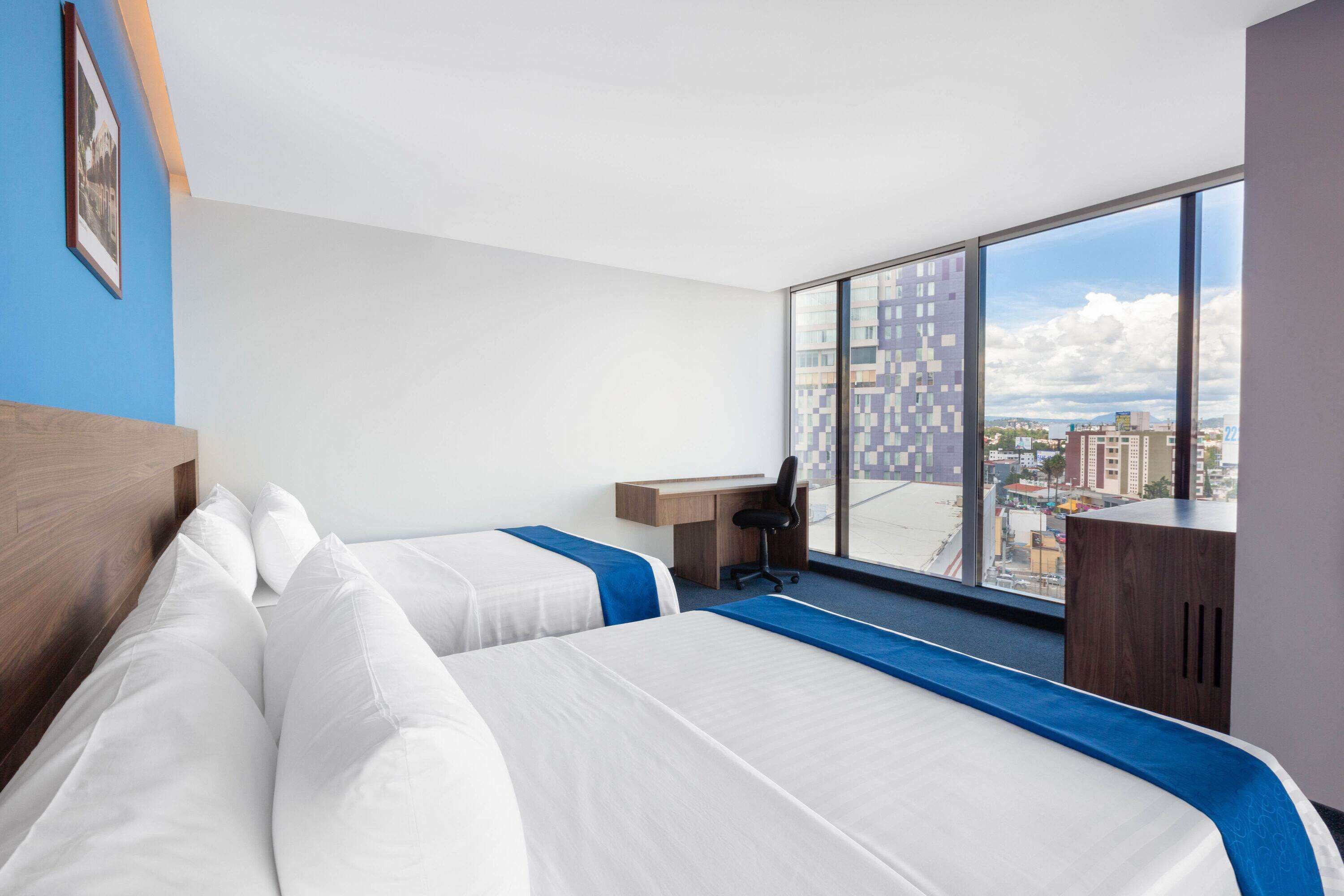 suite, 2 queen beds, non smoking | individually decorated, desk, laptop workspace, blackout curtains