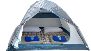 A dome-shaped tent with a bed inside, featuring two pillows and two blue blankets. - Ozone Tented Camp See the Star (Pak Chong)