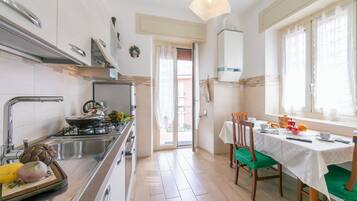 Family Apartment, 2 Bedrooms, Terrace (Residenza La Terrazza di Dante: 2BR) | Private kitchen | Dining tables